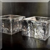 G09. Simon Pearce glass candle stands.